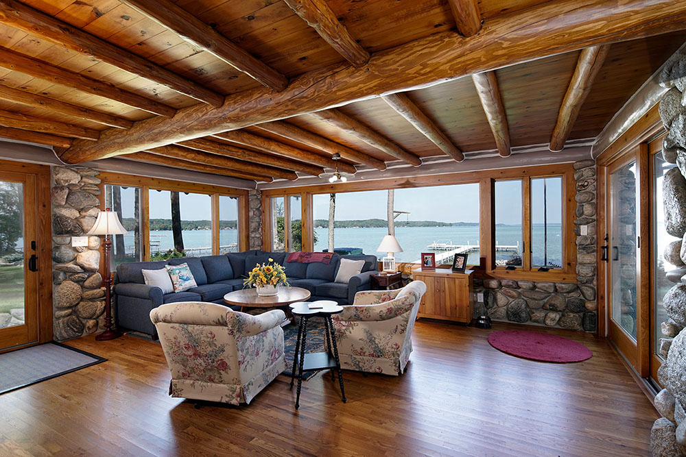 Log cabin addition with lake view